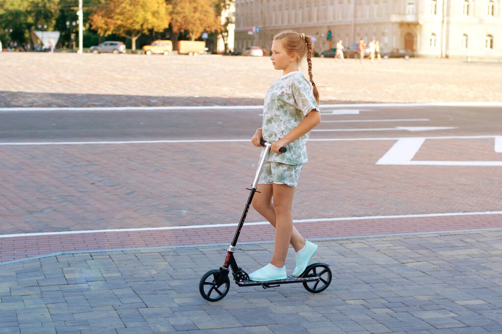stock-photo-cute-teen-girl-rides-town-scooter-sunny-summer-day?token=w17422081115RMp7ALiJLhXoz1rVZ3xOEvbqXBxs
